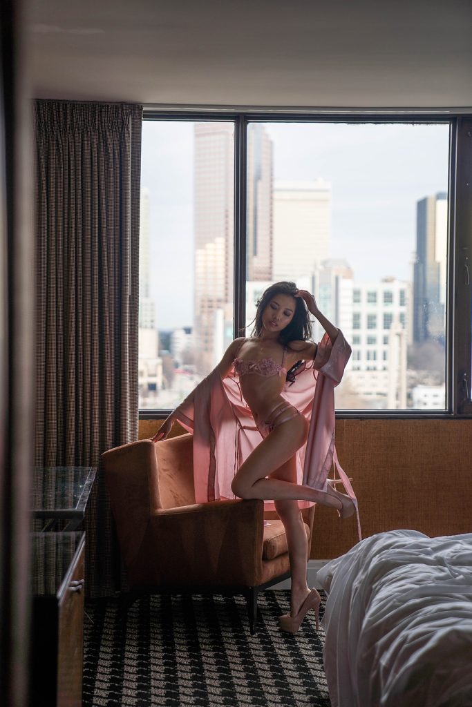 Client wearing a pink robe with matching lingerie set